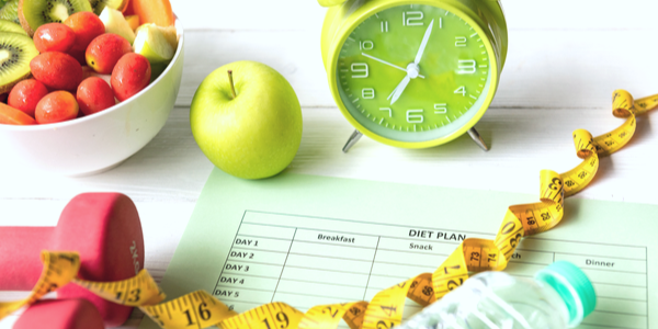 Lose weight concept. Bathroom scale, measuring tape, apples on